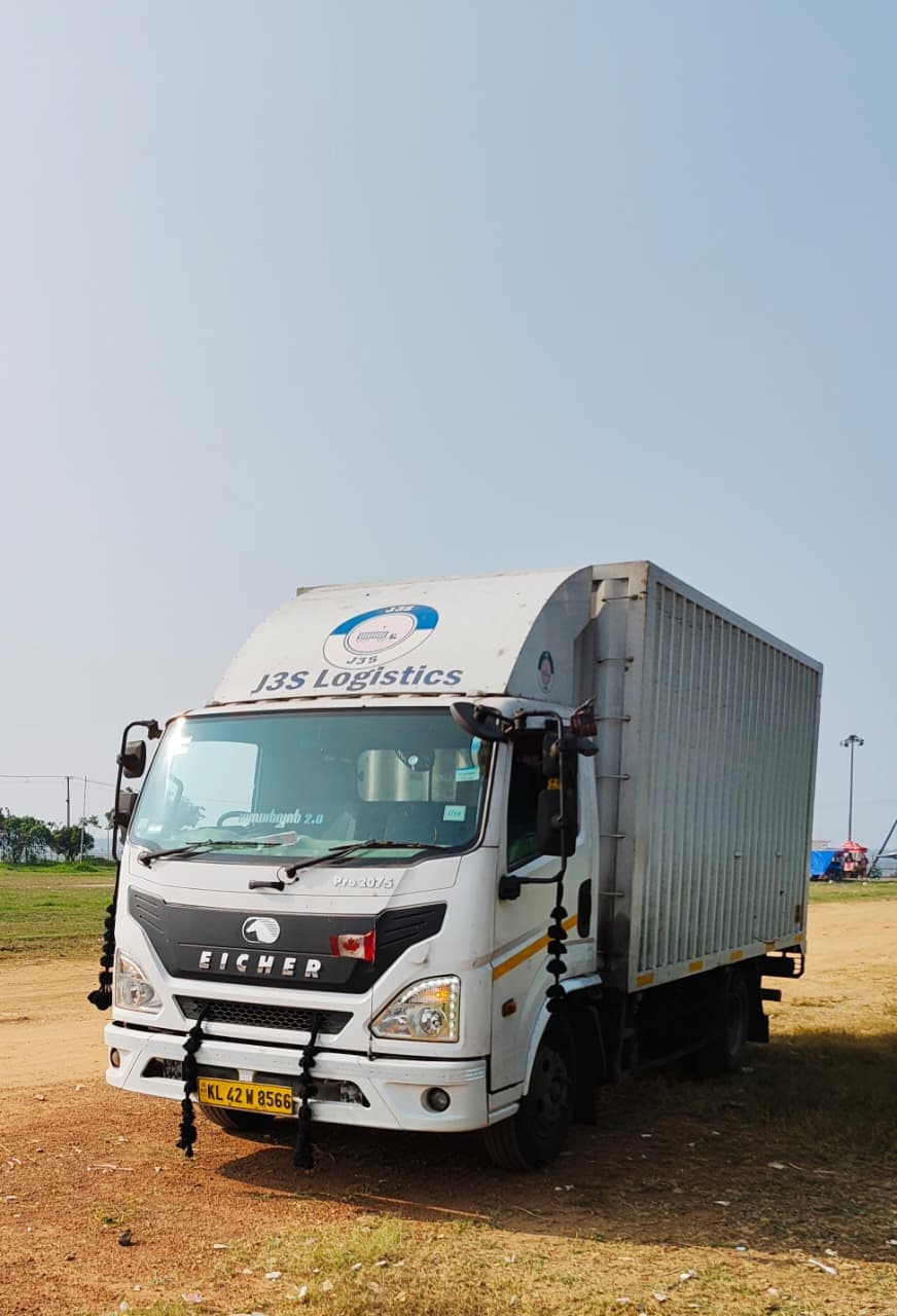 J3S Logistics enclosed cargo truck in transit yard